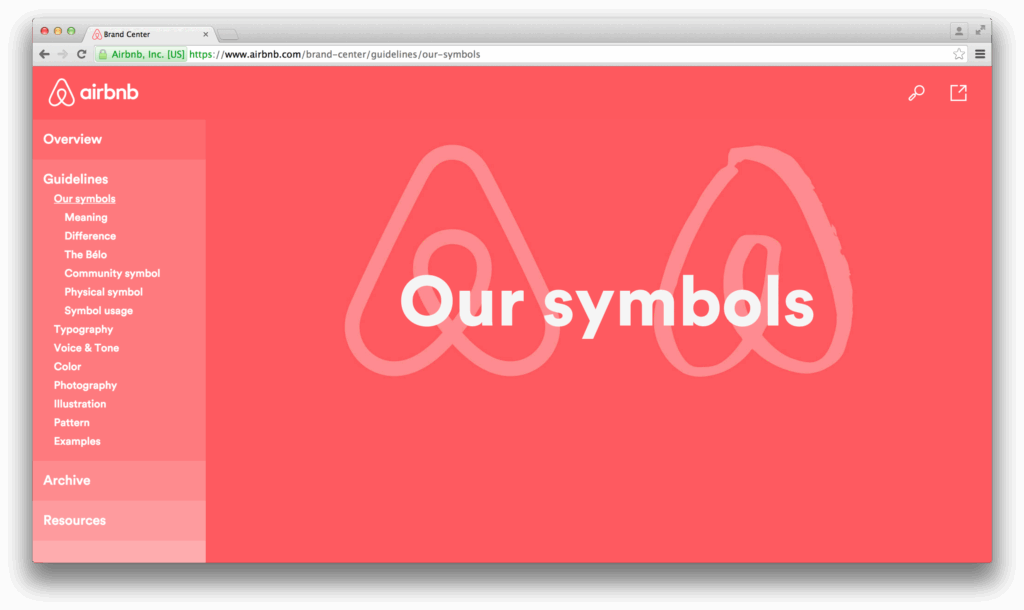 Airbnb brand guidelines page with a focus on symbols and the Bélo logo, displayed on a red background.